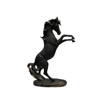 A high-resolution, clean product photo of the matte black rearing horse statue with bronze highlights on its mane and base, standing on a white marble surface. The orange sticker has been removed.