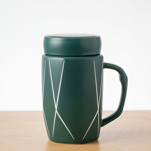 A deep emerald green ceramic mug by Gift by Hamza featuring white geometric patterns and a matching lid.