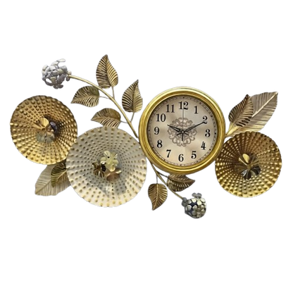 Golden floral branch metal art wall clock featuring textured flower disks and leaves mounted on a textured grey wall.
