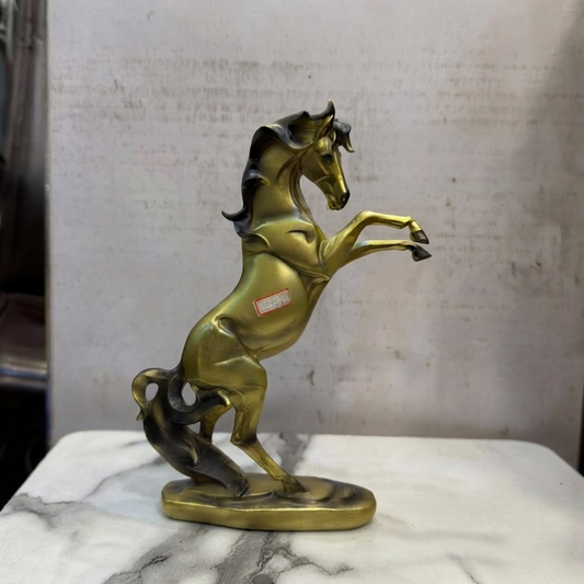 A premium gold-toned rearing horse statue by Gift by Hamza with elegant dark highlights and a smooth, stable base.