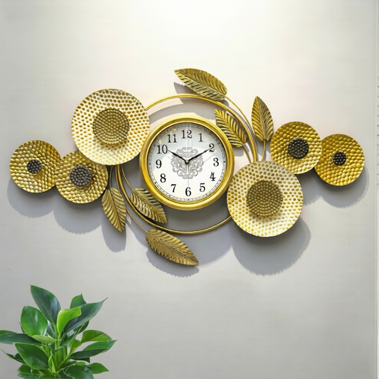 Golden sunflower metal art wall clock featuring textured floral sculptures and a central clock face mounted on a light wall.