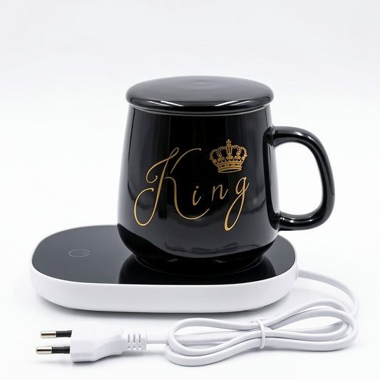 A black ceramic 'King' mug with a matching lid, placed on an electric drink warmer, perfect for keeping coffee hot.