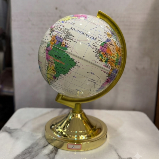 A premium decorative world globe by Gift by Hamza with a shiny gold base and stand, perfect for elegant home or office decor.