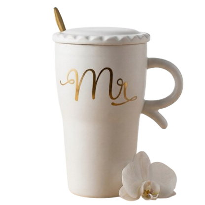 A sophisticated white ceramic mug by Gift by Hamza featuring 'Mr' in gold calligraphy, complete with a matching lid and gold spoon.