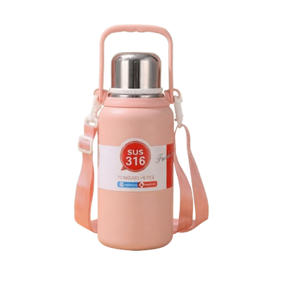 A pastel pink SUS 316 stainless steel insulated water bottle with a silver cap, top handle, and pink shoulder strap standing on a wooden surface.